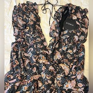Storia brand, sexy double v-neck jumpsuit. Size medium.